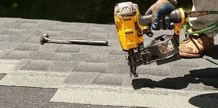 Roof repair in progress on a Michigan home