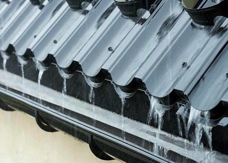 Gutter system inspected for proper drainage