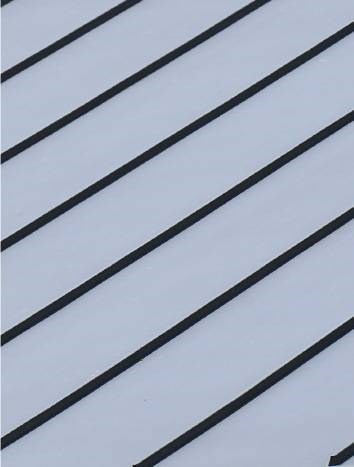 Metal roofing panels on building