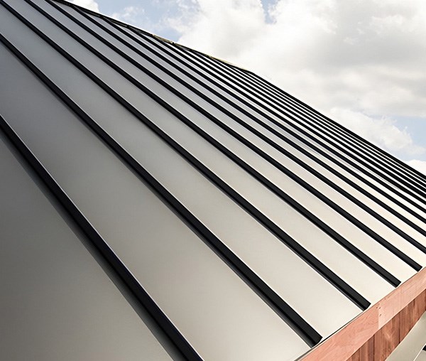 Metal roof panels are shown on a new roof installation