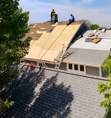 Full roof replacement in progress on a Michigan home